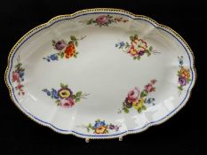 NANTGARW PORCELAIN OVAL DISH circa 1818-1820, of lobed form, painted with a formal arrangement of