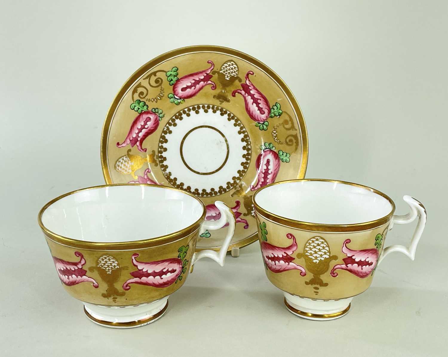 SWANSEA PORCELAIN TRIO circa 1815-1817, decorated in Empire-style pattern of buff tulips and