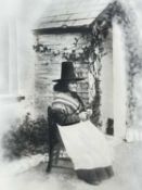 UNKNOWN black and white still photograph - of a lady seated in Welsh costume outside a