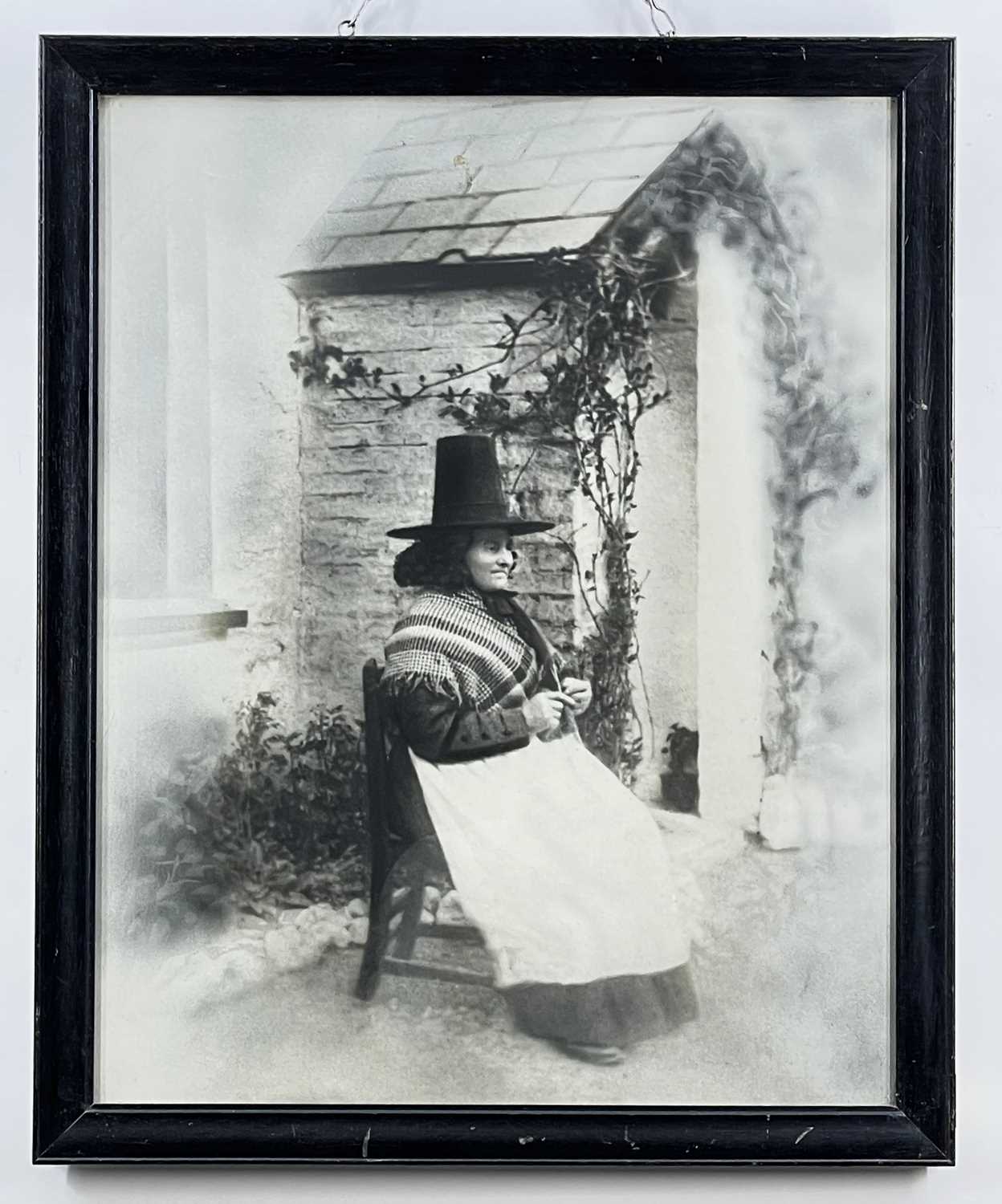 UNKNOWN black and white still photograph - of a lady seated in Welsh costume outside a - Image 2 of 2
