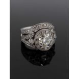 MODERN PLATINUM DIAMOND ENCRUSTED ENGAGEMENT RING & MATCHING WEDDING BAND, the central stone