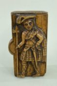 SCOTTISH TREEN SNUFFBOX carved in the style of the 'Blind Man of Ayrshire' with a highlander holding