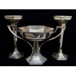 GARNITURE OF THREE GEORGE V PANELLED SILVER VASES, Walker & Hall, Sheffield 1916, of hexagonal