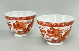 PAIR CHINESE IRON RED 'DRAGON & PHOENIX' PORCLEAIN TEA BOWLS, Guangxu 6-character mark, outside