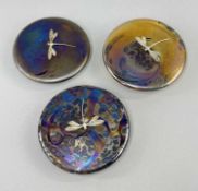 THREE KRIS HEATON ART GLASS PAPERWEIGHTS, of circular disk design with applied sterling silver