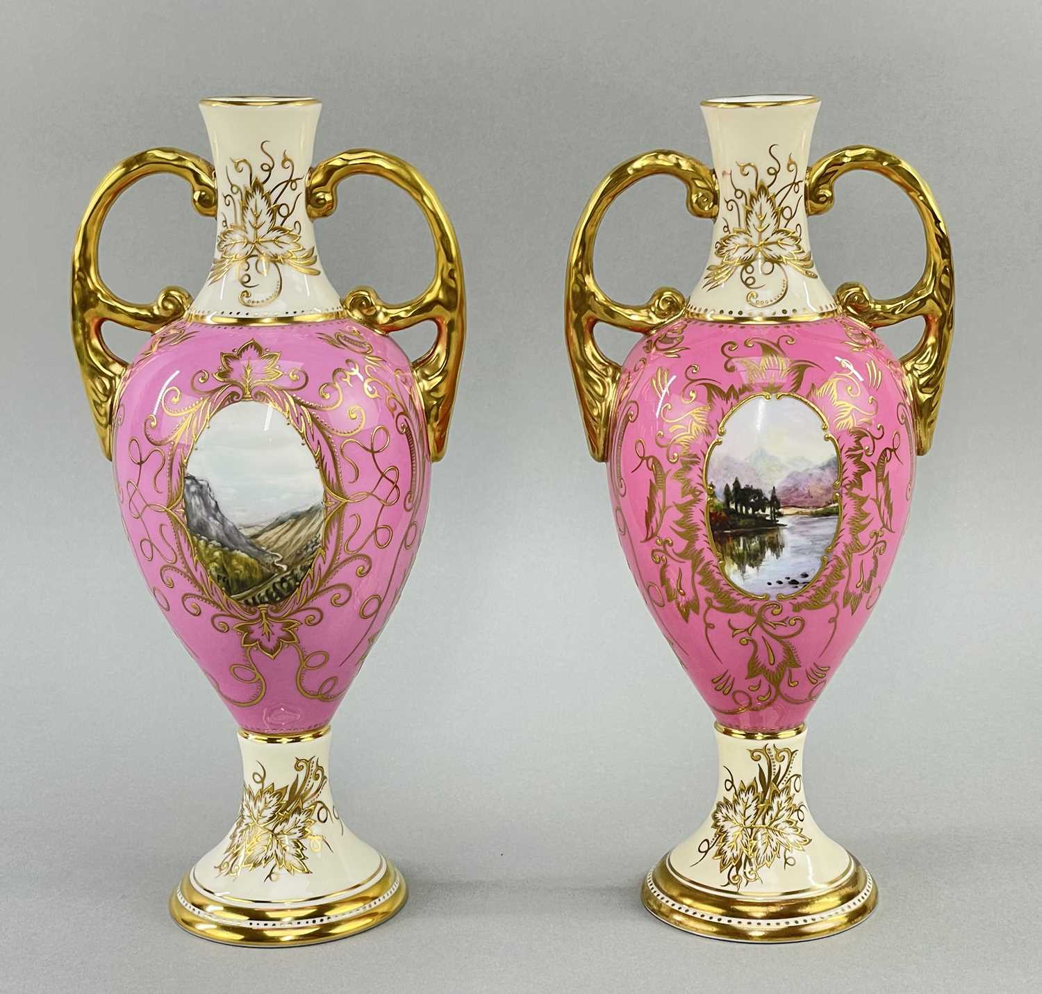 MATCHED PAIR COALPORT TWIN HANDLES VASES, each painted with two oval vignettes of Highland
