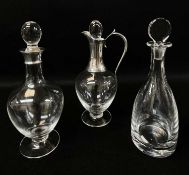 THREE CONTEMPORARY GLASS DECANTERS, the claret decanter and baluster decanter with silver mounts