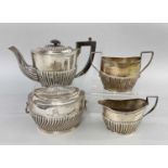 EDWARD VII SILVER BACHELOR'S TEA SET, Birmingham 19091, small half fluted oval, with matched tea