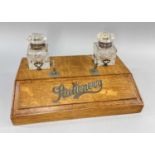 EARLY 20TH CENTURY OAK INK STAND / STATIONARY BOX, fitted two cut glaSs inkwells and labelled