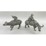 PAIR CHINESE PATINATED BRONZE MODELS OF BOYS ON BUFFALOS, 19cm long (2)