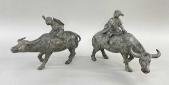 PAIR CHINESE PATINATED BRONZE MODELS OF BOYS ON BUFFALOS, 19cm long (2)