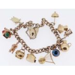 9CT GOLD CURB LINK CHARM BRACELET, having heart shaped padlock, with eleven charms mainly unmarked