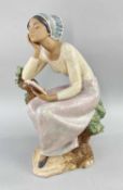 LLADRO STONEWARE 'POETIC MOMENT' FIGURE (12299), lady seated on a tree stump with book, matt