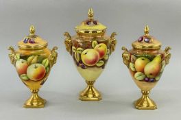 GARNITURE OF THREE COALPORT PORCELAIN VASES & COVERS, each painted with autumn fruit, gilt