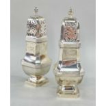 TWO SIMILAR SILVER PIERCED CASTERS, of square design raised on pedestal bases, London & Birmingham