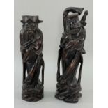 PAIR CHINESE CARVED WOOD FIGURES, of immortals 25cm high (2) Comment: one with chip to base