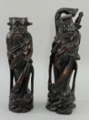 PAIR CHINESE CARVED WOOD FIGURES, of immortals 25cm high (2) Comment: one with chip to base