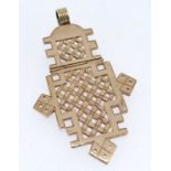 YELLOW METAL TWO SECTION HINGED PENDANT, of Ethiopian Coptic cross form, unmarked, 22.7gms