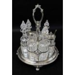 VICTORIAN 7-BOTTLE ELECTROPLATED CRUET STAND, Elkington & Co., foliate openwork frame with scallop