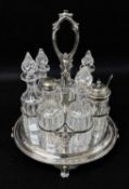 VICTORIAN 7-BOTTLE ELECTROPLATED CRUET STAND, Elkington & Co., foliate openwork frame with scallop