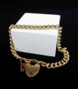 YELLOW GOLD CURB LINK BRACELET, having heart shaped padlock with engraved initials and marked '