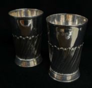 PAIR GEORGE III SILVER BEAKERS, London 1817/1818, half wrythen fluted, on flared circular feet, 11.