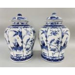 PAIR CHINESE BLUE & WHITE PORCELAIN BALUSTER JARS & COVERS, painted in the Kangxi-style, with