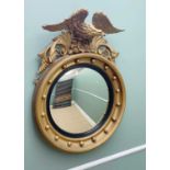 REGENCY-STYLE GILTWOOD & GESSO CONVEX MIRROR with eagle and acanthus surmount, 92 cms