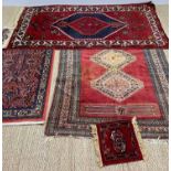 THREE SMALL ORIENTAL RUGS including a Saroukh style rug, 134 x 69cms, two Caucasian rugs and a small