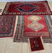 THREE SMALL ORIENTAL RUGS including a Saroukh style rug, 134 x 69cms, two Caucasian rugs and a small