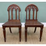 PAIR VICTORIAN GOTHIC REVIVAL HALL CHAIRS, arched pieced backs with trefoils, tapering square