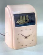 VITASCOPE INDUSTRIES LTD, pale pink bakelite 'automaton' clock with three masted sailing ship