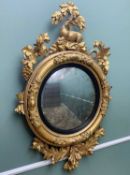 REGENCY-STYLE GILTWOOD & GESSO CONVEX MIRROR, with deer, oak leaf and vine surmount, 120cms