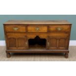 LATE GEORGE III OAK DRESSER BASE, plank top above three frieze drawers, cupboards and dog kennel
