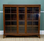 EARLY 20TH CENTURY OAK BOOKCASE on splayed legs, four shelves (three adjustable), two glazed doors