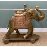LARGE SHEET BRASS & COPPER CUPBOARD CARVED ELEPHANT, on wheeled base, 115cms high x 48cms wide x