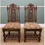 PAIR 17TH CENTURY-STYLE CARVED OAK HALL CHAIRS, elaborate backs carved with green man mask, fruiting