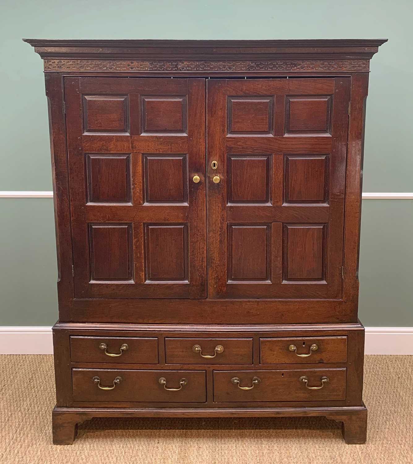 LATE 18TH CENTURY WELSH OAK PRESS CUPBOARD, probably Cardiganshire, cavetto cornice and blind fret