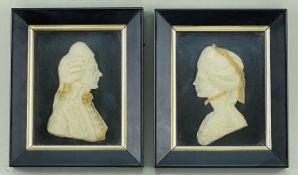 PAIR GEORGIAN STYLE WAX RELIEFS, of a gentleman and lady, labels verso inscribed '...by Leslie Ray',