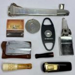 CIGAR/CHEROOT SMOKING ACCESSORIES four various cigar cutters including a large 19cms length