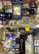 VINTAGE & LATER COSTUME JEWELLERY displayed on two trays including sets of rosary beads and other