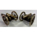 NAPOLEONIC BRASS & WOOD MODEL CANNONS, A PAIR - probably mid 20th Century, 13.5cms H, 41.5cms