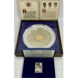 DANBURY MINT STERLING SILVER COMMEMORATIVES x 2, to include a 26cm diameter plate in display case,