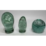VICTORIAN GREEN GLASS DUMP PAPERWEIGHTS (3) - to include a waisted form example with interior flower