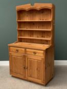 MODERN PINE DRESSER with three shelf shaped top rack and three drawers over two cupboard doors,