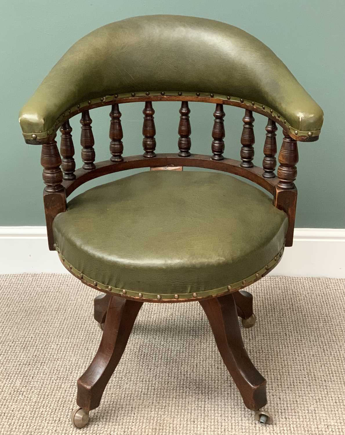 CAPTAIN'S TYPE OFFICE CHAIR, upholstered in green vinyl, on a swivel and castor base, 80cms H, 66cms - Image 2 of 3