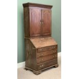 GEORGIAN OAK BUREAU BOOKCASE, the upper section with raised panelled doors and the base having