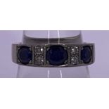 AN 18CT WHITE GOLD DRESS RING - having 3 well sized sapphires with 4 intervening tiny diamonds, 8.
