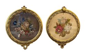 19TH CENTURY GILT FRAMED FLORAL TAPESTRIES - circular formats, one in the style of Stumpwork, both