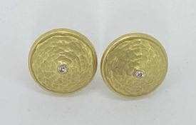 18 CT GOLD CIRCULAR DOMED EARRINGS, A PAIR - each with a tiny diamond centre, butterfly fixings,